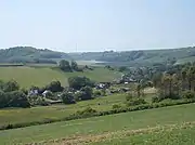 The village of Gatcombe set within rolling chalk downland