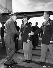 General Marshall greets Major General John R. Deane and Brigadier General Stuart Cutler while arriving at Potsdam, Germany on July 15, 1945.