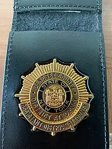 The badge of an Assistant District Attorney in Genesee County, NY.