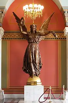 The Genius of Connecticut (1877–78), Connecticut State Capitol, Hartford, Connecticut. Painted plaster cast, the original bronze statue was damaged and destroyed.