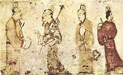 Two gentlemen engrossed in conversation while two others look on, a painting on a ceramic tile from a tomb near Luoyang, Henan province, dated to the Eastern Han dynasty (25–220 AD)