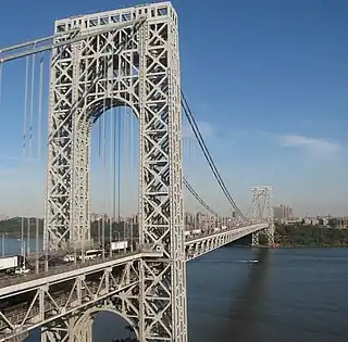 Image 29The George Washington Bridge, connecting Fort Lee (foreground) in Bergen County across the Hudson River to New York City (background), is the world's busiest motor vehicle bridge. (from New Jersey)