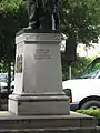 Inscription on the left side of the monument.