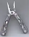 A Gerber "Suspension" multi-tool, with pliers open.  Pliers are spring-loaded, for easy use.