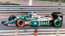 In its first year, Benetton raced in green livery with Sisley (a Benetton brand) and Benetton as sponsors, this is Gerhard Berger racing for Benetton at Detroit in 1986