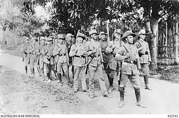 Soldiers marching through the jungle