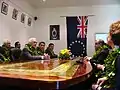 New Zealand Governor General and members of the Cook Islands cabinet wear lei at a meeting.