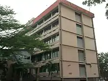 Tan, five-story building