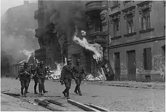 NARA copy #11, IPN copy #13An assault squadWaffen SS troops at Nowolipie Street with Nowolipie 50 A, 52, 54 and 56 in the back.