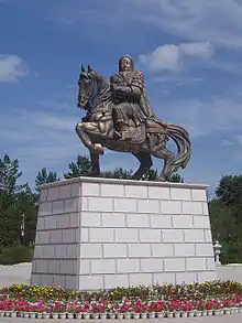 Statue of horseman atop a plinth,