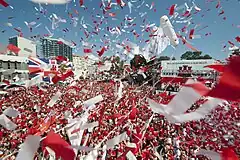 Image 32Thousands of Gibraltarians dress in their national colours of red and white and fill Grand Casemates Square during the 2013 Gibraltar National Day celebrations (from Culture of Gibraltar)