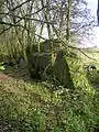 An old blast wall next to the station in 2008. The OS maps show that a railway line ran from near here to the Lime Kilns at Nettlehirst until at least 1912.