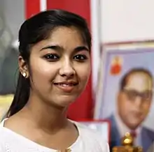 Ginni Mahi with Dr. B.R. Ambedkar's photograph in the background