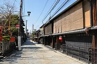 Sudare of various ages on a street in Kyoto. These are not cloth-bound at the edges.