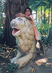 Image 3A girl in Udaipur playing "Jungle Child" (from Girls' toys and games)