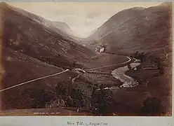 Wilson's August 1885 photograph of the Glen Tilt looking upstream toward Forest Lodge.    Location: 56°49′29″N 3°47′38″W﻿ / ﻿56.82461°N 3.79392°W﻿ / 56.82461; -3.79392﻿ (Glen Tilt June 2019)