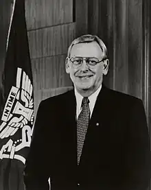 Glenn A. Goerke by a University of Houston flag