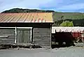 Goods shed, loading bank, and Hc Class cattle wagon.