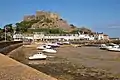 The castle of Mont Orgueil dominates village and harbour of Gorey