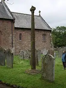 The Gosforth Cross beside St Mary's Church, Gosforth. It is over fourteen feet high.