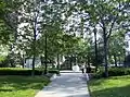 The central green of the park is a common lunch spot for office workers