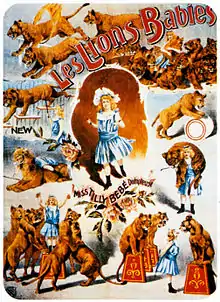 A poster depicting various scenes of lions performing circus tricks with their handler, who is a young girl, dressed in a blue pinafore.