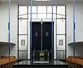 Interior of the synagogue with the Bimah and the Holy Ark in the back