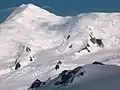 Great Needle Peak from Miziya Peak, with Sliven Peak and Atanasov Nunatak in the foreground, Huron Glacier with Kukeri Nunataks and Nestinari Nunataks in the middle, and Great Needle Peak and St. Ivan Rilski Col surmounting Plana Peak and Kardam Buttress in the background