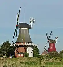 Image 57Two smock mills with a stage in Greetsiel, Germany (from Windmill)