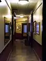 Second floor hallway of the Grim Building in Kirksville, Missouri. Photos and displays highlight the town's medical history.