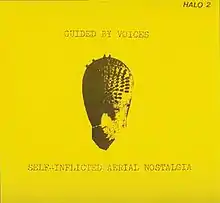 A flat yellow background with a strange mask-like image in the middle and the band name and album title printed in distressed, typewriter font.