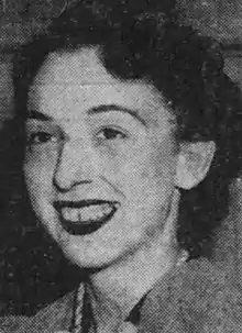 A young white woman smiling, from a 1940 newspaper photograph