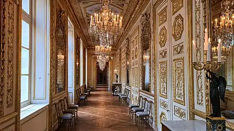 The gilded hallway connecting the naval salons