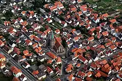 Aerial view of St. Ägidius Church and surrounding area in the Höpfingen subdivision