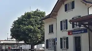 Three-story building with gabled roof