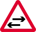 Two-way traffic across a one-way road ahead