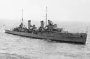 Large World War II-era warship at sea