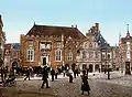 In this photograph from c.1900 the tower is gone, the stairs have their railing, the balcony is gone, and on the right a large clock can be seen that served until after WWII.