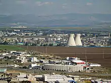 Image 112The oil refinery in Haifa, Israel, is capable of processing about 9 million tons (66 million barrels) of crude oil a year.  Its two cooling towers are landmarks of the city's skyline. (from Oil refinery)