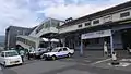 The west entrance of the station in 2014. To the right is the old station building, since demolished. The sign says "Thank You, Haiki Station".