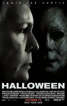 A woman with a worried face looks ahead, with the face of Michael Myers closely near her.