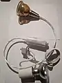 Two H-track fixtures for mains-voltage light bulbs, by Hampton Bay. Model No. EC719 (white, E26/[PA]R20) ES0208SBA (brown, GU10/MR16).