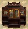 Hanging Cabinet by Benn Pitman designer, Emma Marqua carver, and Charles T. Webber painter, American black walnut, white oak, painted panels, brass