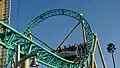 Hangtime's train as it passes over the ride's entrance