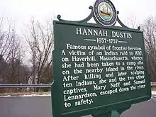 Modern roadside historical marker in Boscawen, New Hampshire about the 1697 scalping incident involving Hannah Duston