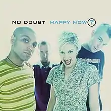 A color photograph of the band appears against a white background displaying the song title.