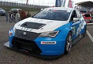 A SEAT León TCR in the ADAC TCR Germany Touring Car Championship paddock