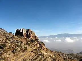 The mountain (background) as viewed from the terraced side of  mountain at Al Mahwit Governorate