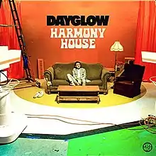 The cover art for Sloan Struble (also known as Dayglow)'s second studio album Harmony House depicts Struble sitting in a living room filming set.