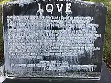 Discolored headstone of Harry Love (2019)